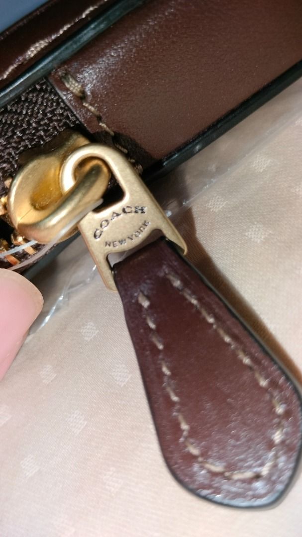 Coach Card Case with Chain (Category: Luxury Bags & Wallets) located in Quezon City. Submitted by amdina03 (Listing ID 1428242966, Image 3). Description: Coach zip card case leather (money back guarantee authentic) If in doubt, please spare us the hassle and buy at the mall. leather with chain and zipper. Hard to find Maple. Includes a clear ID window and 2 card slots and 1 pocket. The zipper pull is embossed with "COACH NEW YORK". Made in the Ph