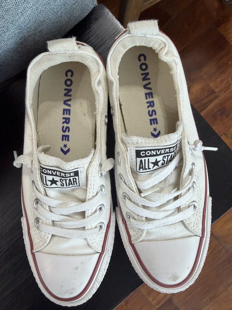 Converse All Star Slip-On White (Category: Sneakers) located in Taguig. Submitted by laineeyyyy (Listing ID 1428196807, Image 1). Description: Seldom used. White Converse All Star slip-on shoes. Features the classic Converse All Star logo on the tongue and side. The shoes have a white canvas upper with a red stripe on the sole. The size is US 5, UK 3, EUR 35, and 22 cm..
