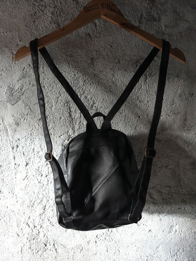 DICKIES | Men's Mini Backpack Black (Category: Backpacks) located in Naga. Submitted by bossyingthrifts (Listing ID 1428202240, Image 3). Description: DICKIES | Men's Mini Backpack Black Mini backpack features a black exterior with a front zippered pocket. It has adjustable shoulder straps and a top handle for carrying. The Dickies logo is prominently displayed on the front. Color rate: 9.5/10 Excellent Condition Issue: minimal rusty buckles, not