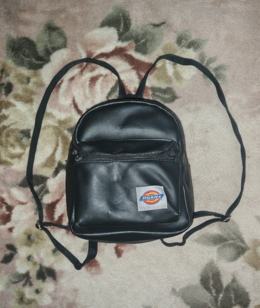 Dickies Mini Backpack (Category: Backpacks) located in Manila. Submitted by esteemed_shop (Listing ID 1428231034, Image 1). Description: Mini backpack features the Dickies logo on the front. It has a zippered main compartment and adjustable straps. It has a top handle for easy carrying..