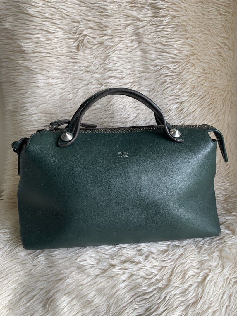 Fendi By The Way (Category: Luxury Bags & Wallets) located in Quezon City. Submitted by she-ann (Listing ID 1428234408, Image 2). Description: Authentic Green leather handbag from Fendi Roma. Features a top handle and a detachable shoulder strap. The bag has a silver zipper and studs. The Fendi Roma logo is visible on the front. No wholes sa corners. Normal signs of usage lang yung corners which can be recolored if you want Flaws: just the edge o