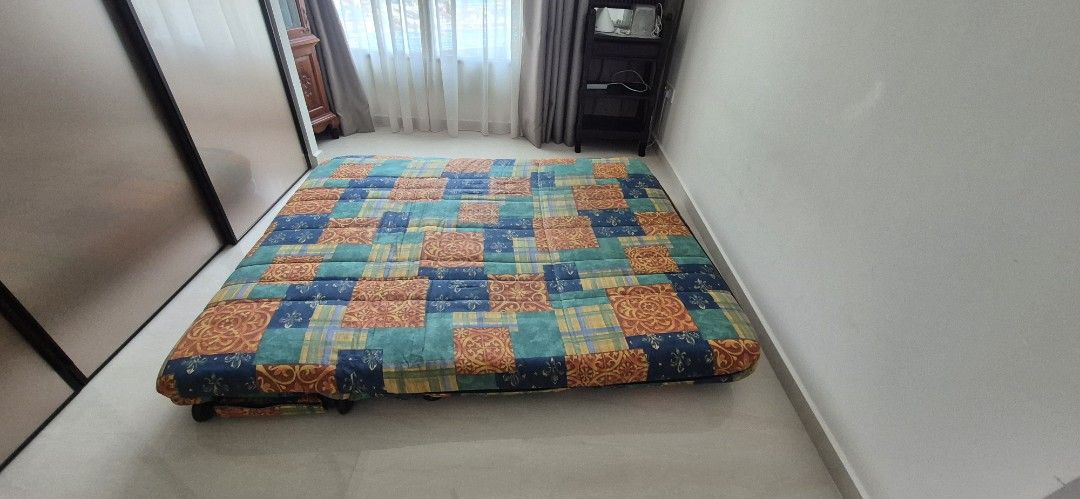 Foldable Patchwork Sofa Bed (Category: Sofas) located in Singapore. Submitted by colin.leong (Listing ID 1428117546, Image 3). Description: Unique patchwork sofa bed in Queen size. Great for a study room or a temporary guest bed. ​Size: Queen size when unfolded. Still folds and unfolds perfectly. ​Design: Vibrant, colorful patchwork fabric. ​Condition: Fabric is clean and well-kept. Please note the internal foam has softened over time. ​Self-coll