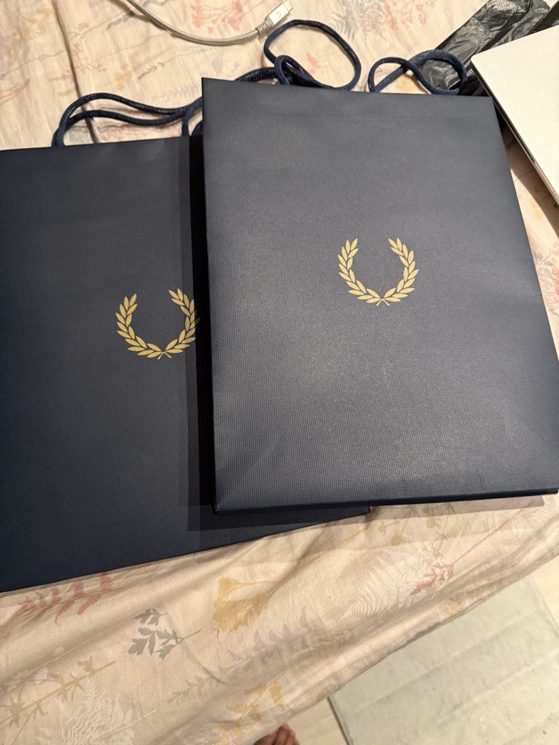 Fred Perry Paper Bag S (Category: Looking For) located in Valenzuela. Submitted by polchipreloveditems (Listing ID 1428210333, Image 1). Description: - Authentic Fred Perry Paper Bag (Size S) - Classic navy blue color - Features the iconic laurel wreath logo - available more than 2.