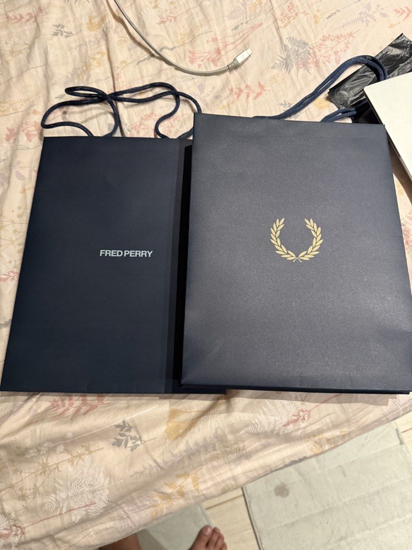Fred Perry Paper Bag S (Category: Looking For) located in Valenzuela. Submitted by polchipreloveditems (Listing ID 1428210333, Image 2). Description: - Authentic Fred Perry Paper Bag (Size S) - Classic navy blue color - Features the iconic laurel wreath logo - available more than 2.
