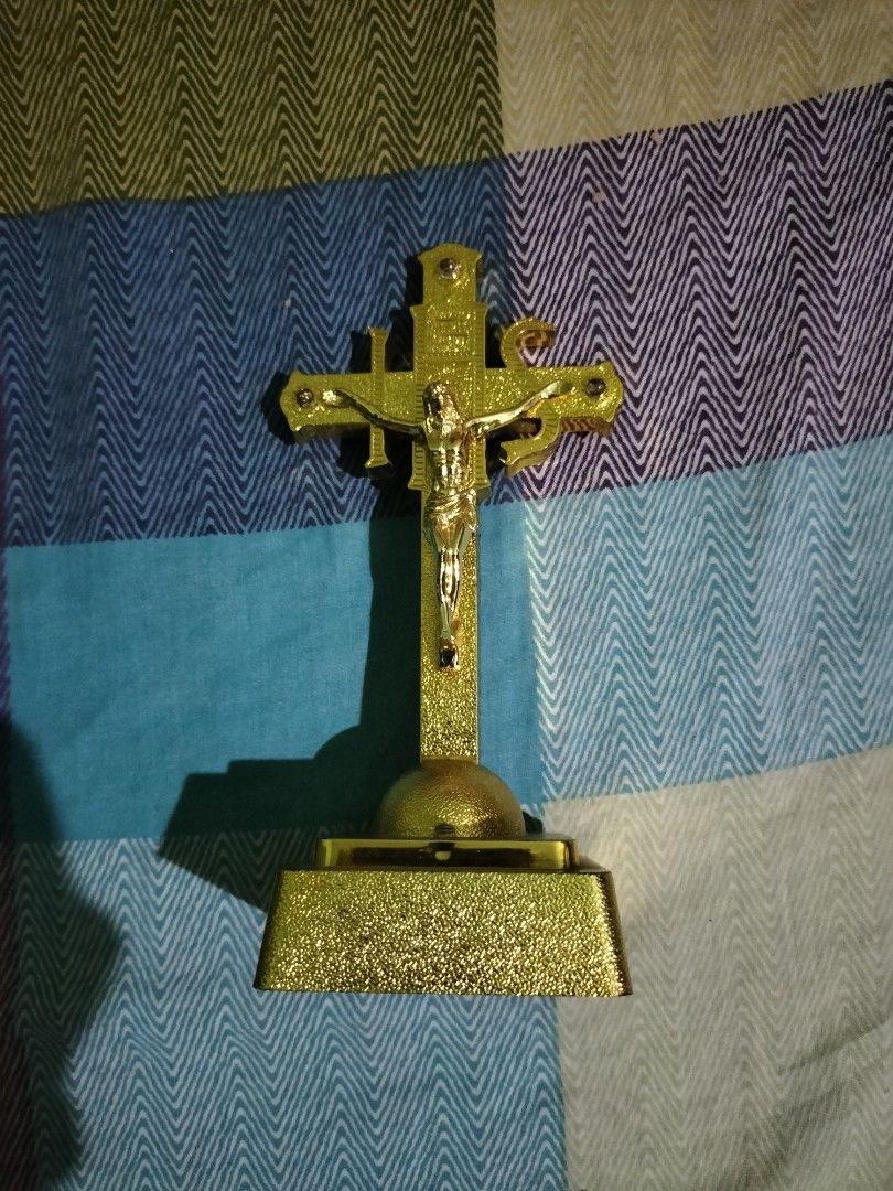 Gold Framed Religious Items Set (Category: Religious Items) located in Cavite. Submitted by taro_sakamoto_23 (Listing ID 1428188490, Image 2). Description: Set includes a gold-framed picture of Jesus, a gold-colored crucifix, and a clear glass block with an inscription. The framed pictures have intricate gold detailing. The crucifix features a figure of Jesus. The glass block has an inscription on it. All items appear to be decorative and suitabl
