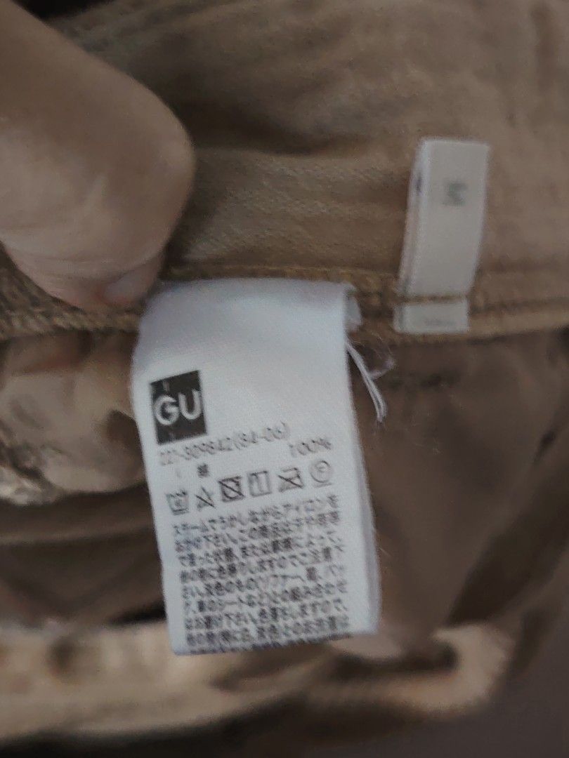 GU Corduroy Wide Leg Pants (Category: Other Bottoms) located in Quezon City. Submitted by nenggie (Listing ID 1428123255, Image 3). Description: Tan corduroy wide leg pants from GU. Features a button and zipper closure. The pants have a relaxed fit and a wide leg opening. The size tag is visible in the image. Fits waistline 26 to 28.