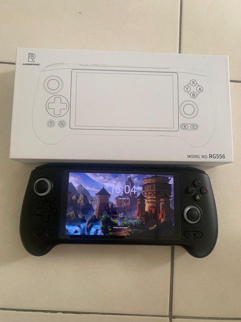 Handheld Console (Category: Others) located in Raub. Submitted by hidayat.abdaziz (Listing ID 1428169213, Image 2). Description: RG556 condition tiptop, jarang guna, semua fungsi ok. Skrin AMOLED cantik, boleh main game PS2 PSP/PS1/N64 dengan smooth. Datang sekali charger. Harga RM 500.