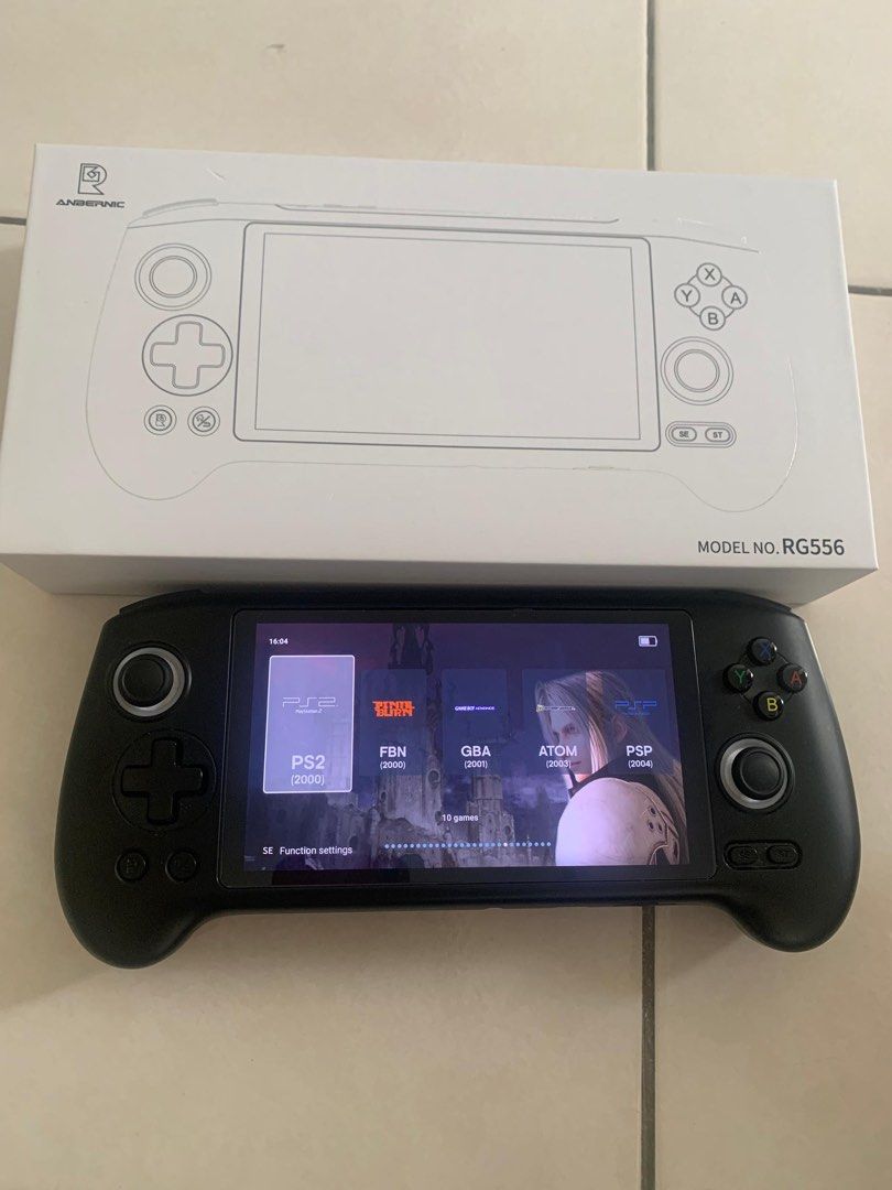 Handheld Console (Category: Others) located in Raub. Submitted by hidayat.abdaziz (Listing ID 1428169213, Image 3). Description: RG556 condition tiptop, jarang guna, semua fungsi ok. Skrin AMOLED cantik, boleh main game PS2 PSP/PS1/N64 dengan smooth. Datang sekali charger. Harga RM 500.