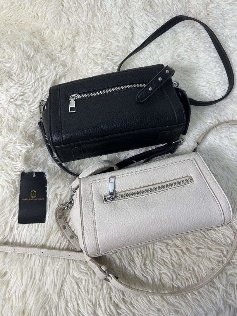 High End Joyous Crossbody Bag (Category: Cross-body Bags) located in Manila. Submitted by riided (Listing ID 1428217676, Image 1). Description: BOTH black unused white slightly used.
