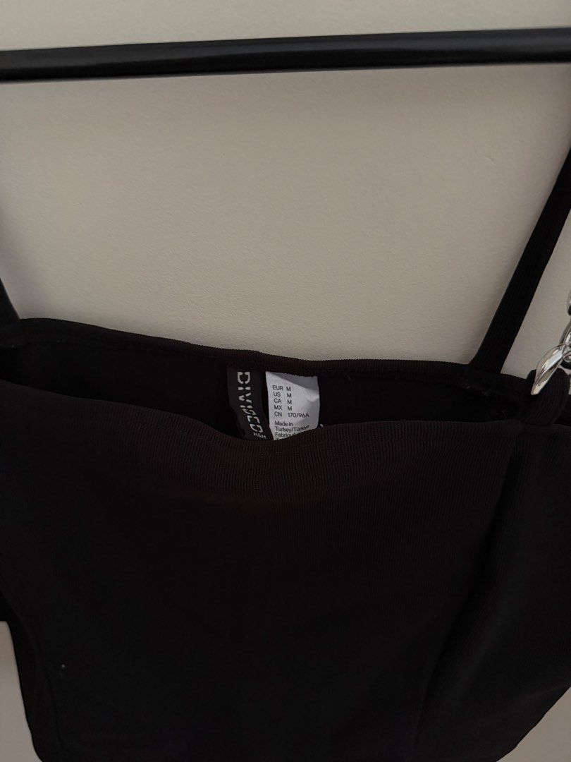 H&M Black Crop Top with Chain Straps (Category: Others Tops) located in Bacolod City. Submitted by 308maria (Listing ID 1428140732, Image 2). Description: - H&M black crop top - Features chain straps - Square neckline - Size: Medium - Made of smooth, likely synthetic fabric.
