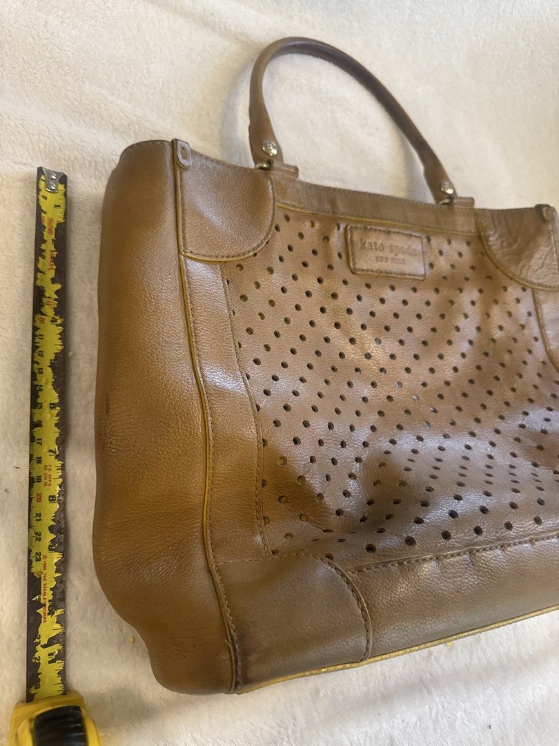 Kate Spade Perforated Leather Tote Bag (Category: Luxury Bags & Wallets) located in Quezon City. Submitted by homedweller (Listing ID 1428142870, Image 3). Description: Bought in the US years ago a few years back. Vintage design, shows usage but still very good leather. Can fit a laptop. Negotiable .