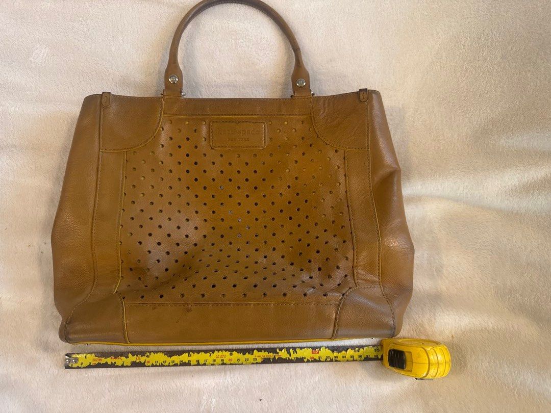 Kate Spade Perforated Leather Tote Bag (Category: Luxury Bags & Wallets) located in Quezon City. Submitted by homedweller (Listing ID 1428142870, Image 1). Description: Bought in the US years ago a few years back. Vintage design, shows usage but still very good leather. Can fit a laptop. Negotiable .