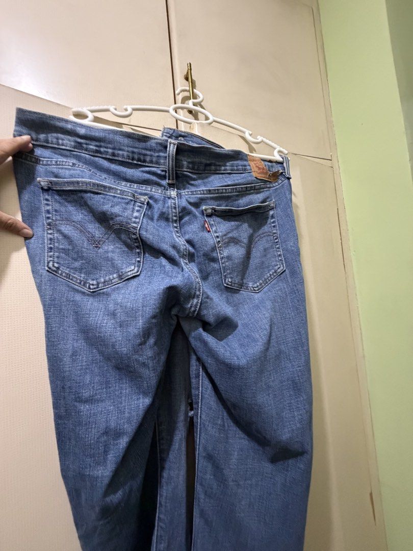 Levi's Boyfriend Jeans - Size 32 (Category: Jeans) located in San Juan City. Submitted by eiaprelovedsj (Listing ID 1428222047, Image 2). Description: Authentic Levi's boyfriend jeans in a light blue wash. Features distressed detailing on the front. Includes the classic Levi's red tab on the back pocket and a leather patch. Size 32. Made in Sri Lanka..