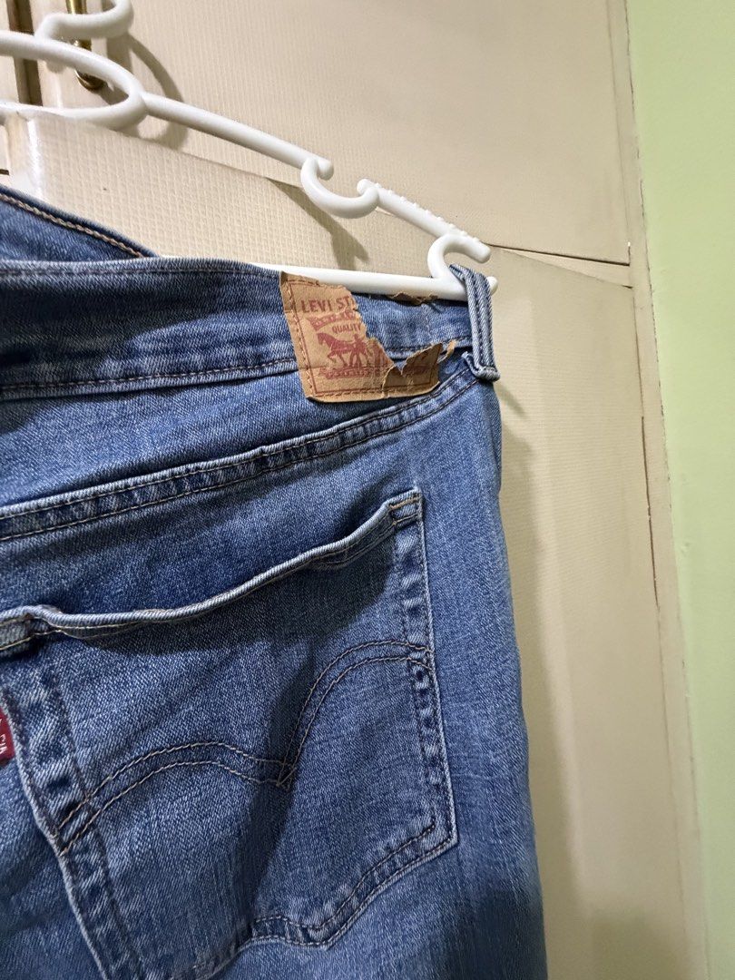 Levi's Boyfriend Jeans - Size 32 (Category: Jeans) located in San Juan City. Submitted by eiaprelovedsj (Listing ID 1428222047, Image 3). Description: Authentic Levi's boyfriend jeans in a light blue wash. Features distressed detailing on the front. Includes the classic Levi's red tab on the back pocket and a leather patch. Size 32. Made in Sri Lanka..