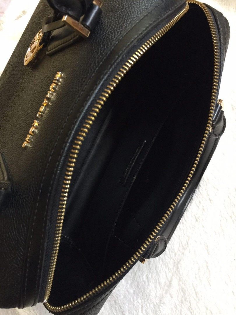 Michael Kors Black Satchel Bag (Category: Luxury Bags & Wallets) located in Tarlac. Submitted by trishatrish3 (Listing ID 1428106630, Image 2). Description: Black Michael Kors satchel bag with gold-tone hardware. Features a top zip closure, dual top handles, and a detachable shoulder strap. Includes a gold MK charm. The interior has a slip pocket and a Michael Kors label. Can be used during duty as doctor's bag.
