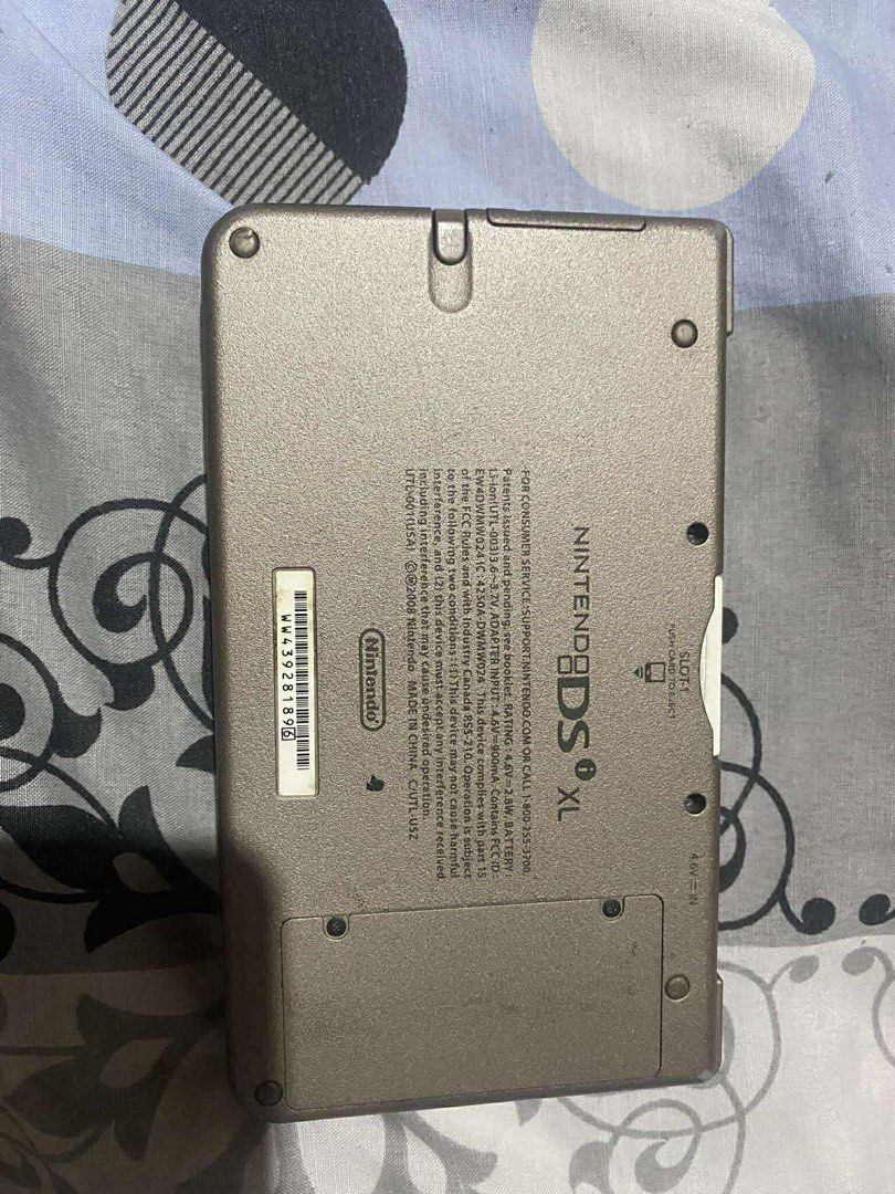 Nintendo DSi XL (Category: Nintendo) located in Manila. Submitted by sakuraa09997 (Listing ID 1428137551, Image 1). Description: Nintendo DSi XL (Bronze) - Unit Only 🎮 Selling my pre-loved Nintendo DSi XL. Still works perfectly (see photos of it running Pokémon). Great for collectors or those who want the best screens for DS gaming! ✅ Price: (Slightly negotiable) ✅ Condition: Tested & Working. Buttons and touch screen are responsive. ✅ Inclusion