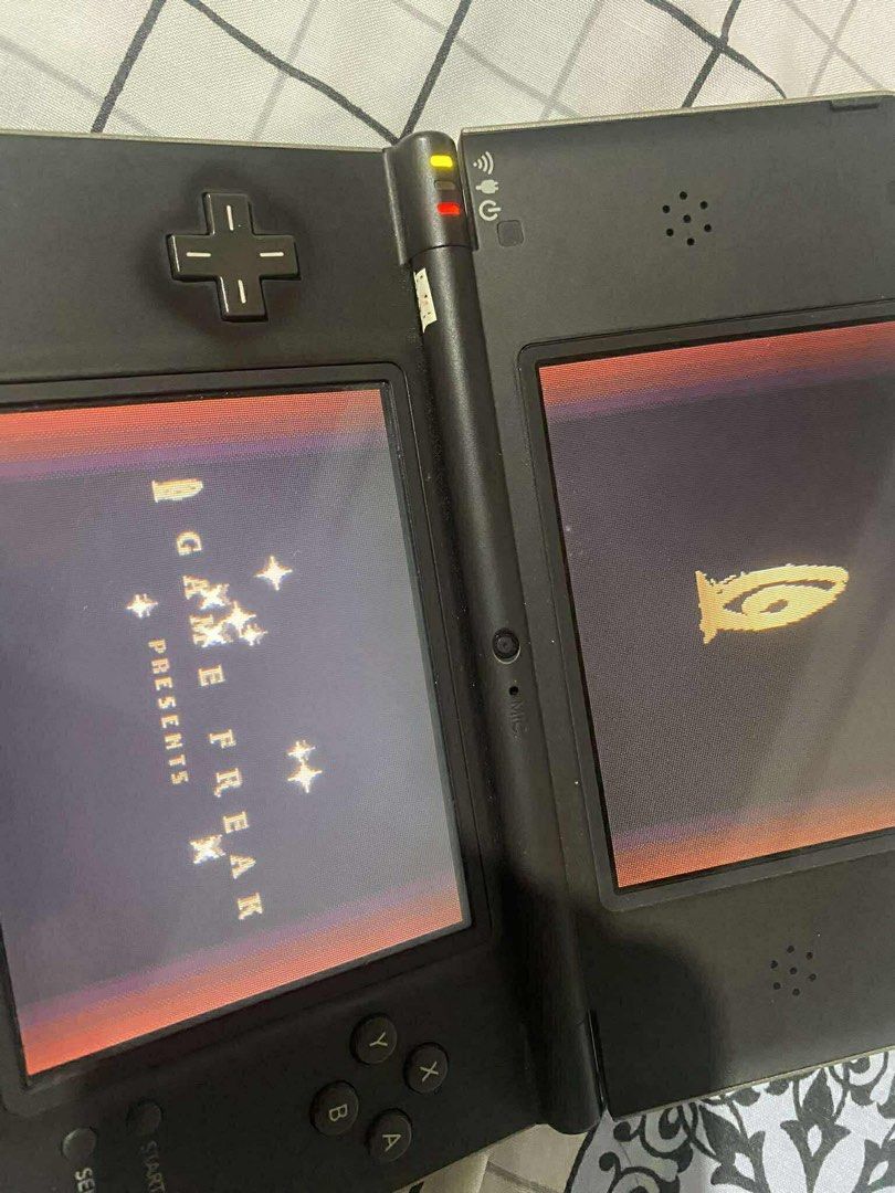 Nintendo DSi XL (Category: Nintendo) located in Manila. Submitted by sakuraa09997 (Listing ID 1428137551, Image 3). Description: Nintendo DSi XL (Bronze) - Unit Only 🎮 Selling my pre-loved Nintendo DSi XL. Still works perfectly (see photos of it running Pokémon). Great for collectors or those who want the best screens for DS gaming! ✅ Price: (Slightly negotiable) ✅ Condition: Tested & Working. Buttons and touch screen are responsive. ✅ Inclusion