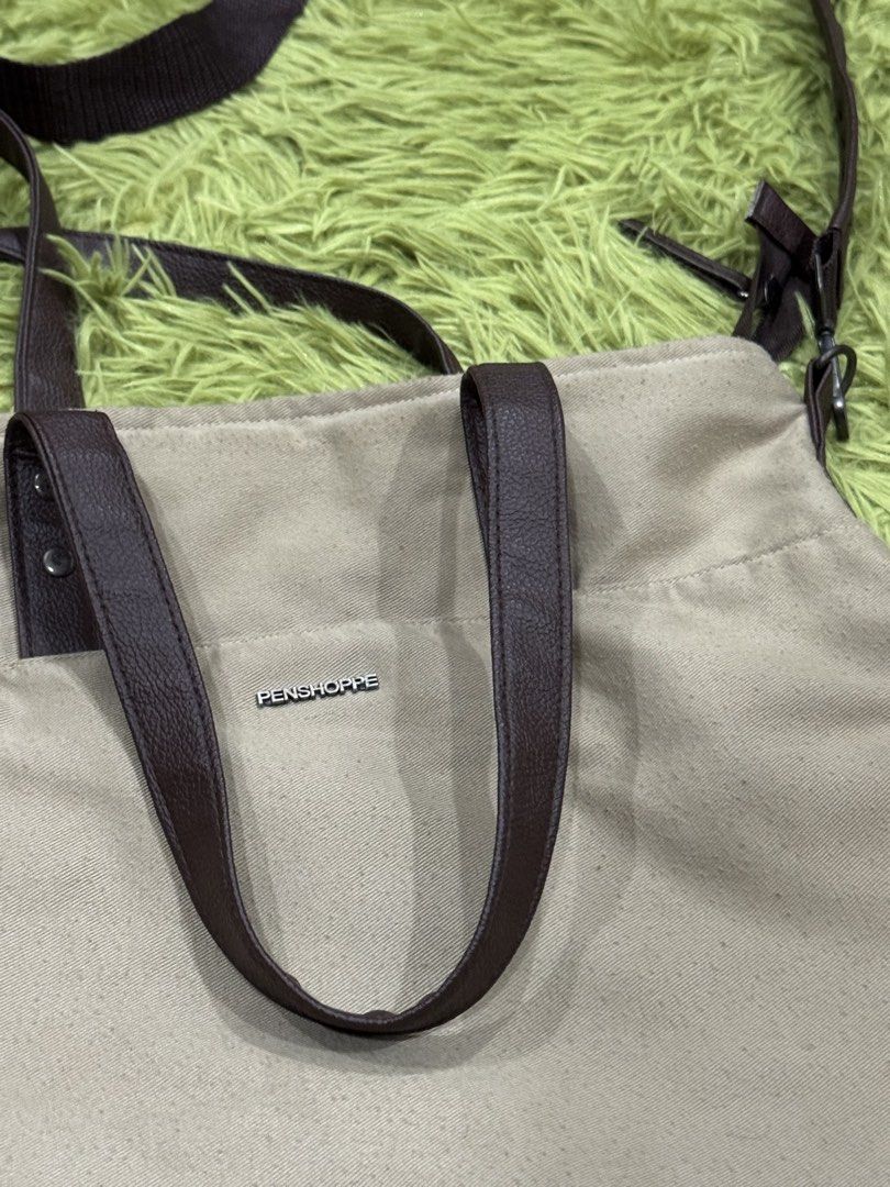 Penshoppe Two-Way Tote/Sling Bag (Category: Sling Bags) located in Pasig City. Submitted by peter_german (Listing ID 1428098000, Image 2). Description: Lightly used and still in good shape. Spacious, practical, and easy to carry with both top handles and a long strap for added versatility..