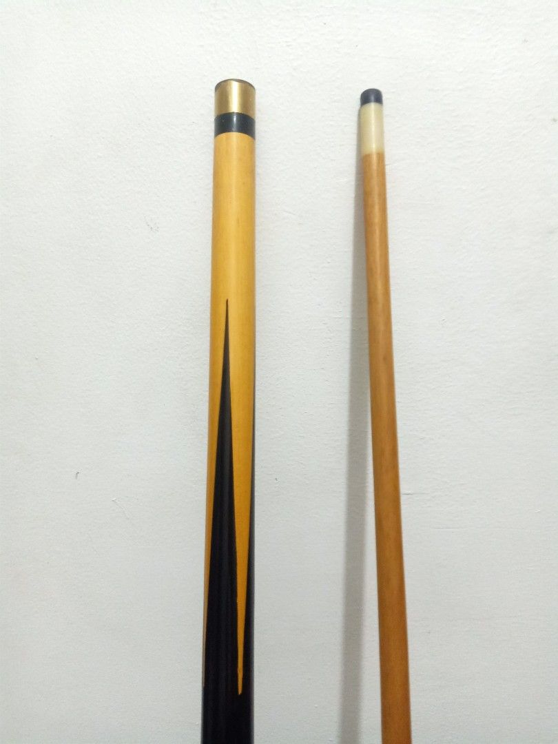 Pool Cue Stick (Category: Billiards and Bowling) located in Las Pinas. Submitted by the_recycle_shop (Listing ID 1428215092, Image 2). Description: Pool cue stick features a black and yellow design. It has a wooden shaft and a white tip. It is a standard size, suitable for most players. The cue is well-maintained and ready for your next game..