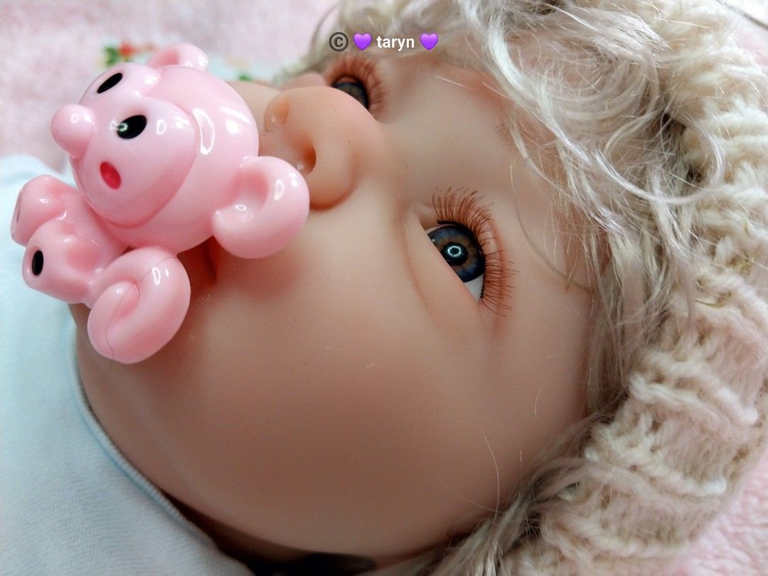 Reborn Baby Doll with Accessories (Category: Babies & Kids Fashion) located in Cebu City. Submitted by iceelily (Listing ID 1428125330, Image 2). Description: Adorable reborn baby doll with realistic features. Comes with a knitted hat, a pacifier, and a baby bottle. The doll is wearing a blue onesie. Includes a birth certificate. Perfect for collectors or as a gift. The doll has detailed hands and feet..