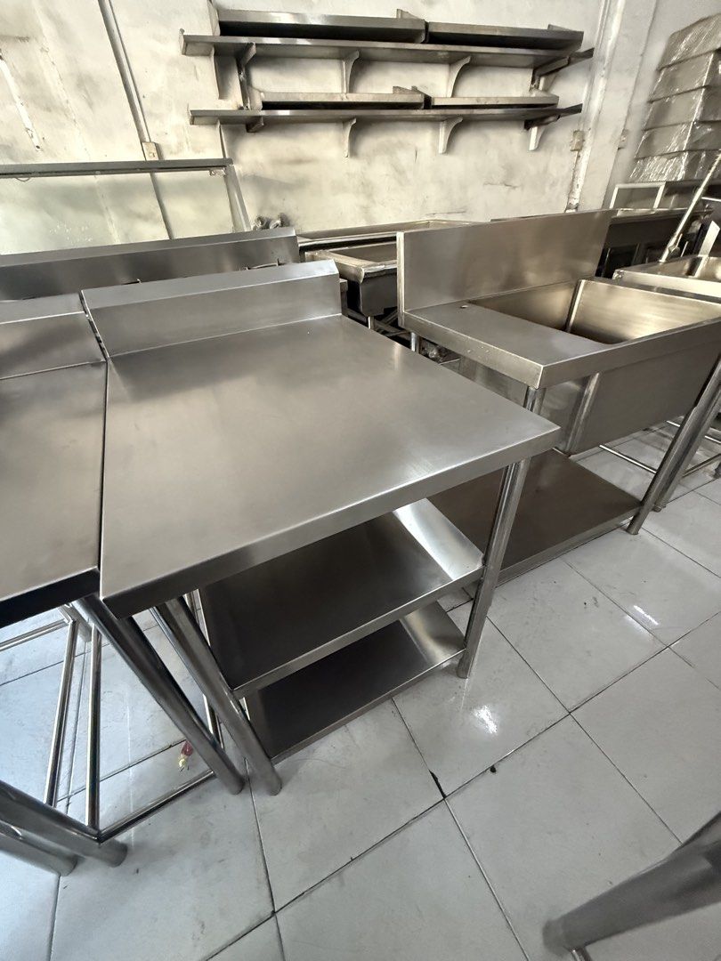 Stainless Kitchen Table with Shelves (Category: Tables & Sets) located in Valenzuela. Submitted by jcsi_stainless (Listing ID 1428228186, Image 2). Description: **ON HAND** STAINLESS FILLER TABLE DIM: 65.3CM X 85CM X 85CM LWH + 15 CM BS Old Display stock with little marks GAUGE 18 1.2MM ALL 304 STAINLESS MATERIAL BEFORE: 17,000.00 PHP NOW: 10,000.00 PHP Readily available for pick-up or delivery. * AVAILABLE IN VALENZUELA DALANDANAN BRANCH All new