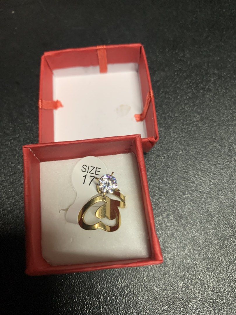 Stainless Steel Heart Ring with Diamond (Category: Rings) located in Manila. Submitted by foreverble80256 (Listing ID 1428117109, Image 2). Description: Elegant stainless steel ring featuring a heart design and a sparkling diamond. It comes in a red box, perfect for gifting or personal use. The ring size is 17. The ring is gold in color. Made of stainless steel..