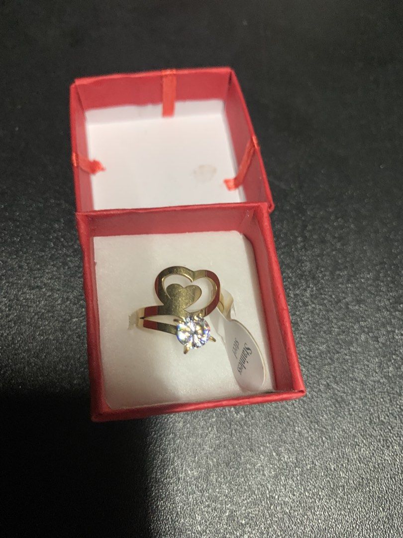 Stainless Steel Heart Ring with Diamond (Category: Rings) located in Manila. Submitted by foreverble80256 (Listing ID 1428117109, Image 1). Description: Elegant stainless steel ring featuring a heart design and a sparkling diamond. It comes in a red box, perfect for gifting or personal use. The ring size is 17. The ring is gold in color. Made of stainless steel..
