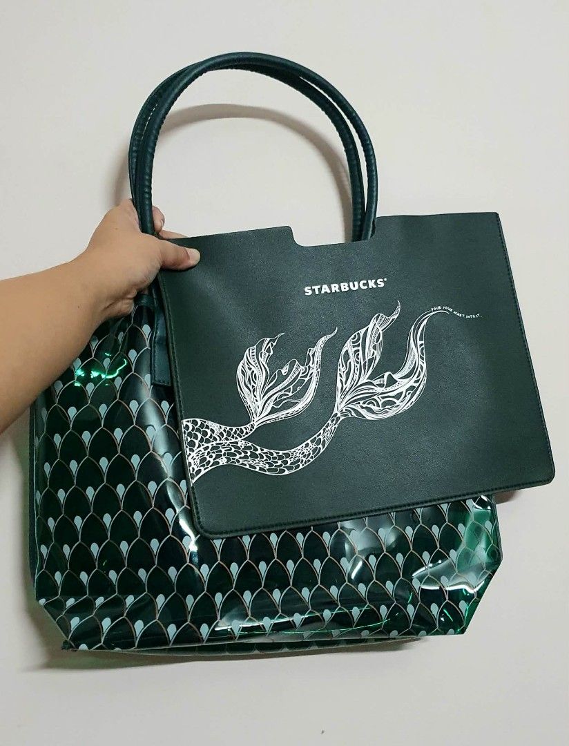 Starbucks Jelly Tote Bag (Category: Tote Bags) located in San Juan City. Submitted by leyuri_shop2025 (Listing ID 1428200334, Image 1). Description: From Starbucks China Exclusives Dragon Boat Festival 2025 Series. The tote bag features a unique mermaid tail design. It includes a detachable inner pouch. The bag has a transparent exterior with a green scale pattern. It has sturdy handles for easy carrying. The bag is perfect for everyday use..