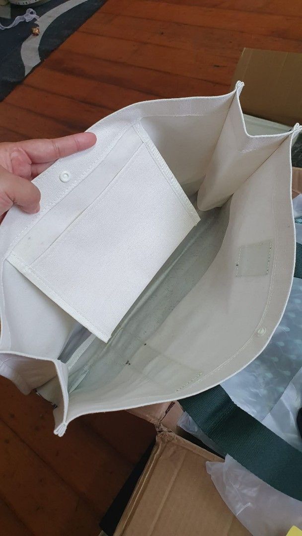 Starbucks Tote Bag (Category: Tote Bags) located in San Juan City. Submitted by leyuri_shop2025 (Listing ID 1428200822, Image 2). Description: From Starbucks China Exclusives Dragon Boat Festival 2025 Series. Stylish Canvas tote bag with coating inside. Features a white body with a green leaf pattern at the bottom and Starbucks branding on the strap. Includes an internal pocket. Spacious enough to carry various items, as shown in the images. Perf