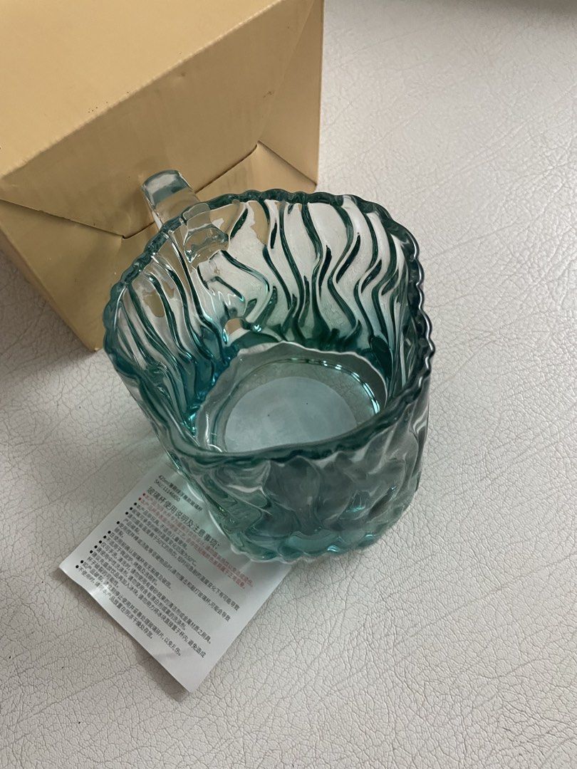 Starbucks Water Relief Glass mug (Category: Home Improvement Tools & Accessories) located in Davao. Submitted by goldcarp (Listing ID 1428097445, Image 3). Description: For sale: Starbucks China Summer Mint Green Water Ripple Relief Glass Mug RARE! Condition: Brand New Authentic. Complete set w box. Description: This hard to find mug features a textured, ripple-like design in a mint green and clear gradient finish with a silver Starbucks Siren lo