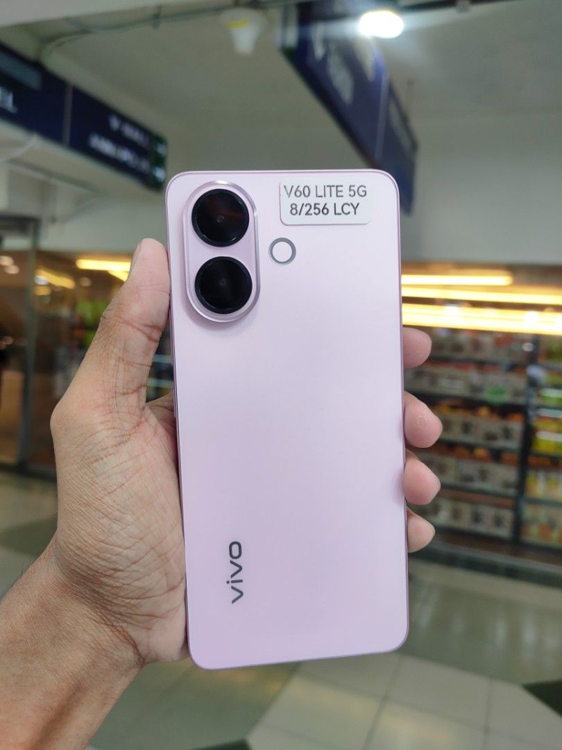 Vivo v60 Lite 5G (Category: Vivo) located in Manila. Submitted by tacorio21 (Listing ID 1428109992, Image 1). Description: - Vivo V60 Lite 5G - Stylish pink color - 256GB storage -No Dents or Any scratches - Ready for use Php 16,000.