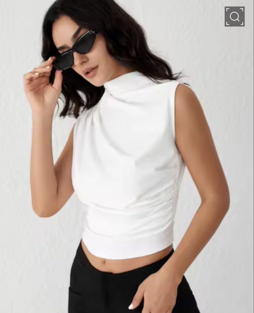 White Sleeveless Turtleneck Top (Category: Sleeveless) located in Cebu City. Submitted by declutterwithmecebu (Listing ID 1428239516, Image 1). Description: Elegant white sleeveless top featuring a stylish turtleneck design. The top has a flattering, ruched detail on the side. It's a versatile piece that can be dressed up or down. Perfect for creating a chic and sophisticated look. A great addition to any wardrobe..