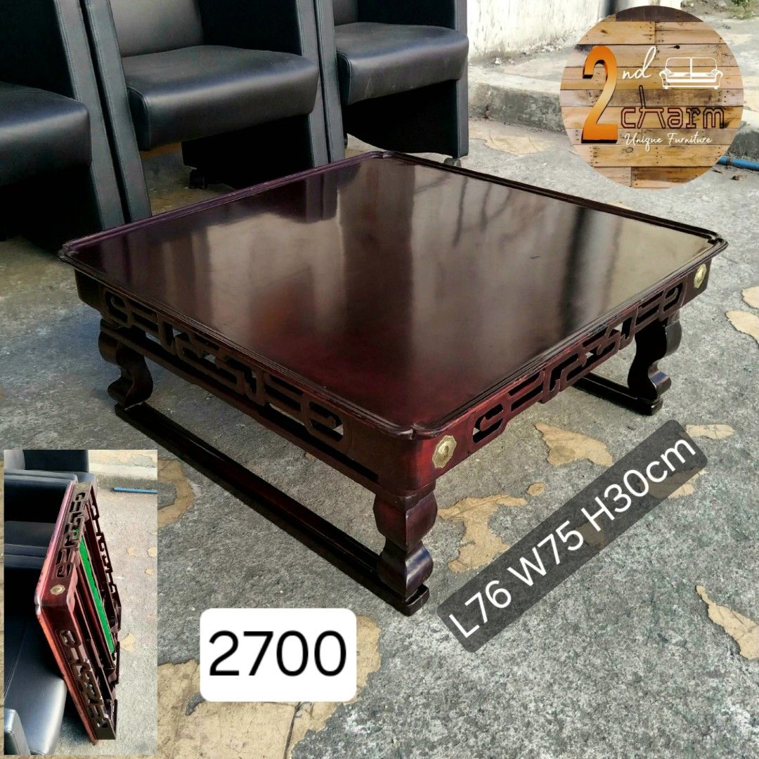 2nd hand Vintage Solid Wood Coffee Table | Foldable Legs (Category: Tables & Sets) located in Paranaque City. Submitted by 2ndcharmfurniture (Listing ID 1428329769, Image 1). Description: Elegant wooden coffee table with a rich, dark finish. Features intricate carved details along the sides and decorative brass accents. The table has a square shape and sturdy legs. Dimensions are L76cm x W75cm x H30cm. Perfect for living rooms or lounges..