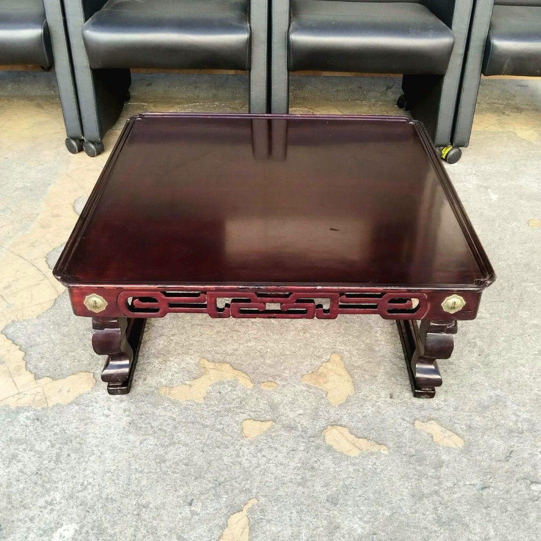 2nd hand Vintage Solid Wood Coffee Table | Foldable Legs (Category: Tables & Sets) located in Paranaque City. Submitted by 2ndcharmfurniture (Listing ID 1428329769, Image 2). Description: Elegant wooden coffee table with a rich, dark finish. Features intricate carved details along the sides and decorative brass accents. The table has a square shape and sturdy legs. Dimensions are L76cm x W75cm x H30cm. Perfect for living rooms or lounges..