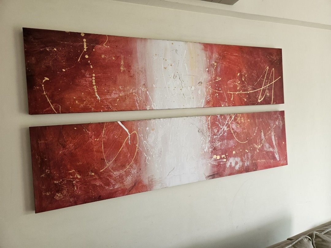Abstract art piece (Category: Wall Decor) located in Singapore. Submitted by bonkadoodle (Listing ID 1428340687, Image 1). Description: Set of two abstract canvas paintings. Features a striking red, white, and gold color palette. Perfect for adding a modern touch to any living space. Has a wooden frame and is ready to be mounted onto the wall. Dimensions of each piece: 160cm (W) x 40cm (H) x 4cm (Thickness).