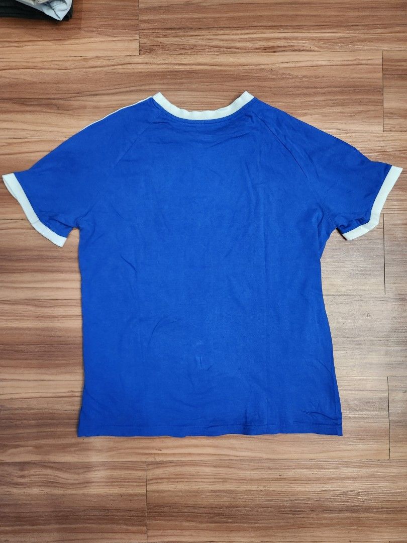 Adidas 3-stripes tee (kids) - Blue (Category: Tshirts & Polo Shirts ) located in Malabon City. Submitted by silverrust12 (Listing ID 1428288848, Image 2). Description: Adidas 3-stripes tee in Blue (for kids) Size on tag - L (kids) Pit-to-pit - 49 cm Length - 64 cm Will be washed and will send more pics upon reservation NCR area Can do meet-ups around SM North or anywhere near LRT stations Can do delivery thru Grab/Lalamove (delivery fee shouldere