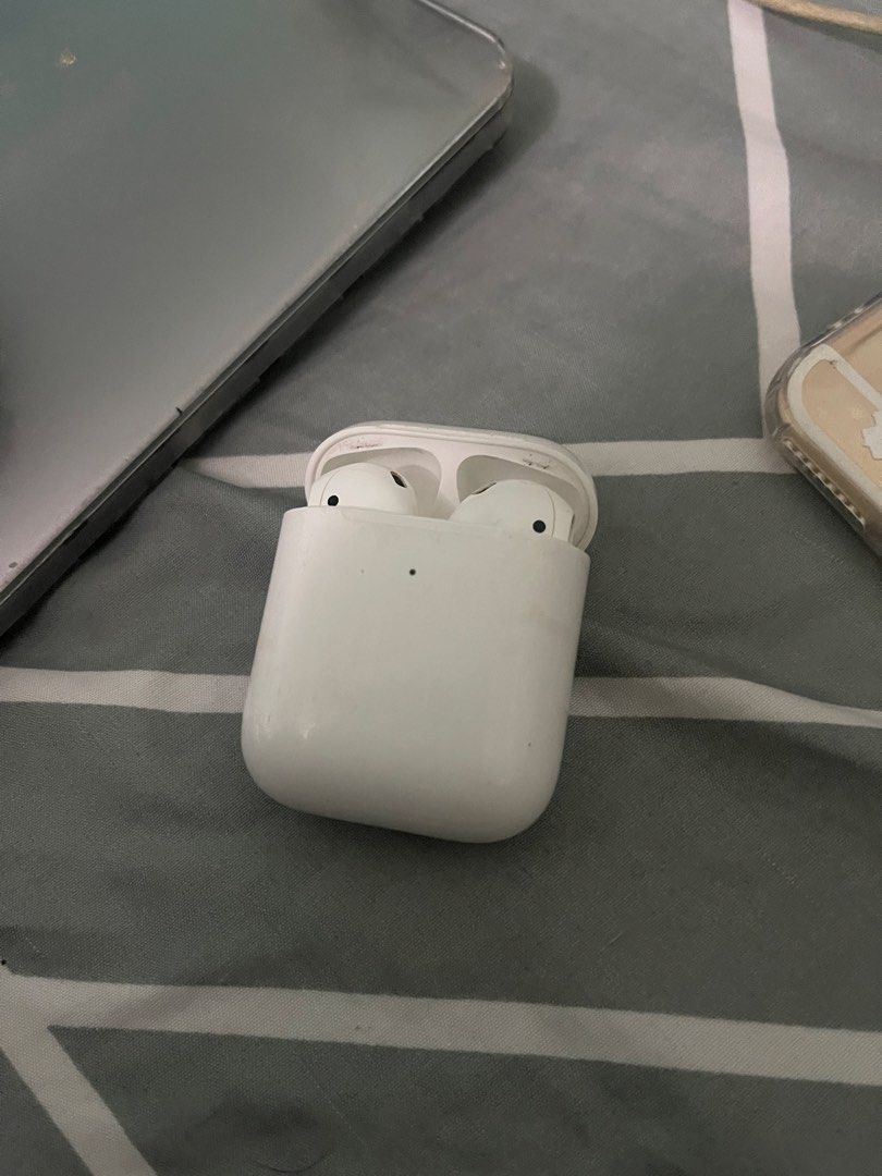 Apple AirPods 2nd Gen (Magsafe Compatible) (Category: Earphones) located in Caloocan City. Submitted by gsrys (Listing ID 1428363473, Image 2). Description: Well-used unit: - Charging case has visible stains/marks - Case still opens/closes smoothly and charges properly Issue : - AirPods (left & right) - Pods have degraded battery health - When removed from the case, they drain extremely fast - Ideal for parts, repair, or replacement units selling