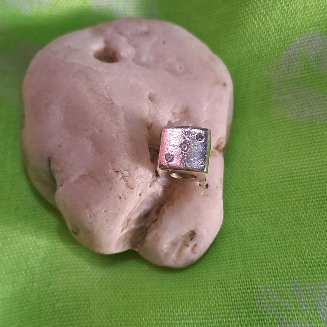 Authentic Pandora Dice Silver Charm with CZ stones (Category: Charms) located in Santa Cruz. Submitted by cedrick17 (Listing ID 1428367211, Image 1). Description: authentic Pandora Silver dice with cz stones can be charm or pendant .