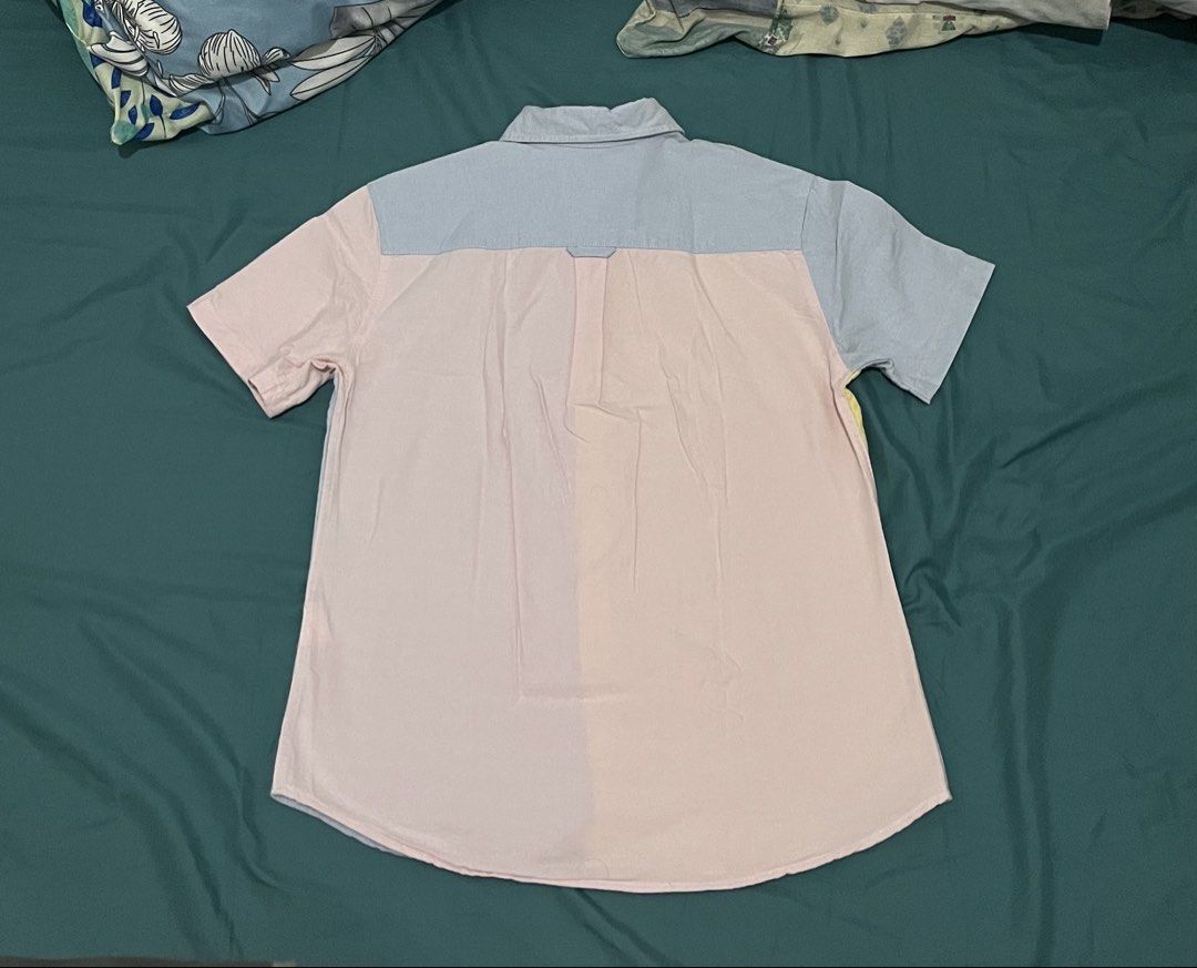 Bench Color Block Shirt - Small (Category: Tshirts & Polo Shirts ) located in Caloocan City. Submitted by graaaaah13 (Listing ID 1428351389, Image 2). Description: Bench color block shirt in pastel colors. Features a button-down front and short sleeves. The shirt has a unique design with different colors on each side. .