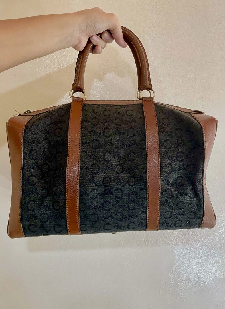 Celine Paris Boston Bag (Category: Luxury Bags & Wallets) located in Manila. Submitted by thevintagebow (Listing ID 1428405168, Image 1). Description: Vintage Celine C-Sulky Boston Bag 🤎 Timeless Parisian elegance meets everyday functionality. This classic Boston silhouette features the iconic navy C-Sulky monogram canvas paired with rich cognac leather trim. A sophisticated staple for any vintage lover. Condition: Well-loved vintage with a beau