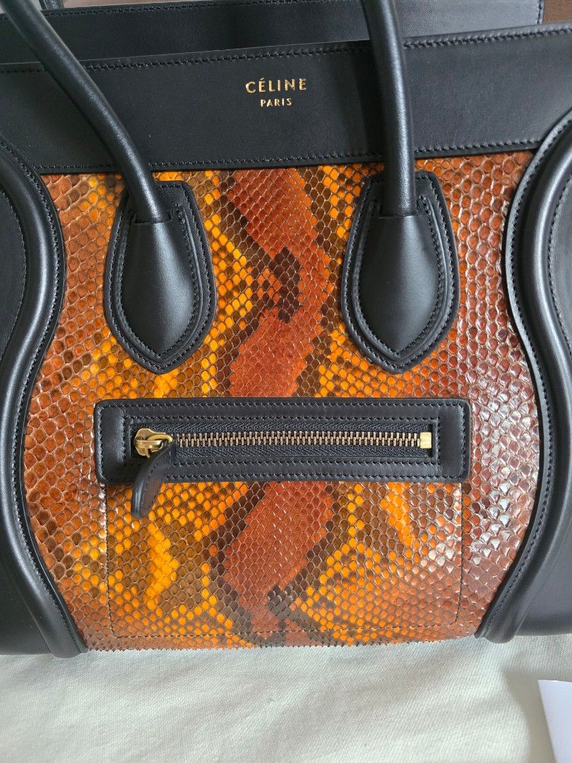 Celine Phantom Python Leather Handbag (Category: Bags & Wallets) located in Singapore. Submitted by candycrush2 (Listing ID 1428301987, Image 3). Description: Authentic Celine Phantom handbag. Part of the old Celine collection! Features a striking python leather front panel and black leather trim. Includes dust bag and tag. Interior has a zipped pocket and a small pocket. Excellent condition, well-maintained. Never worn! .