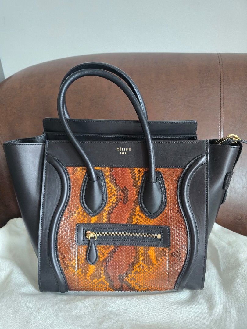 Celine Phantom Python Leather Handbag (Category: Bags & Wallets) located in Singapore. Submitted by candycrush2 (Listing ID 1428301987, Image 1). Description: Authentic Celine Phantom handbag. Part of the old Celine collection! Features a striking python leather front panel and black leather trim. Includes dust bag and tag. Interior has a zipped pocket and a small pocket. Excellent condition, well-maintained. Never worn! .