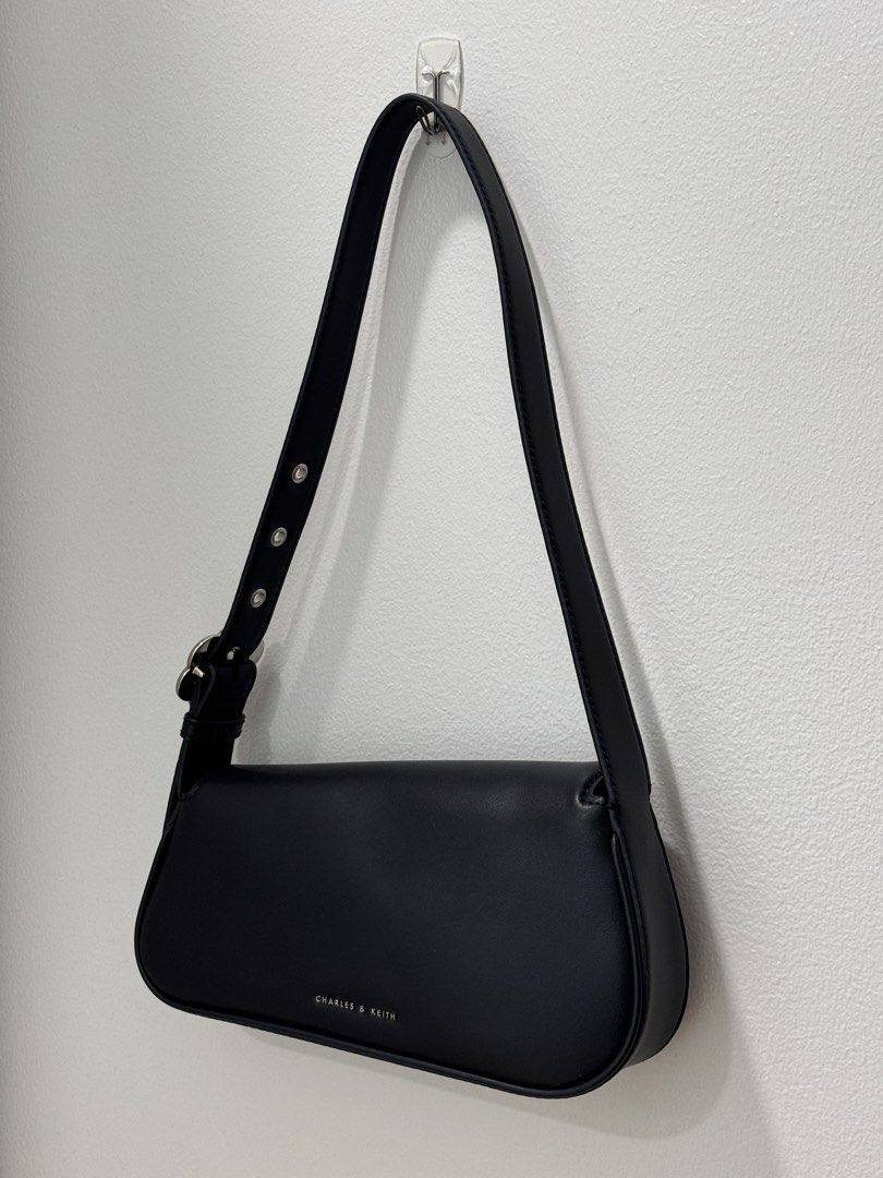 Charles & Keith Petra Asymmetrical Bag Black (Category: Shoulder Bags) located in Quezon City. Submitted by dreamhues (Listing ID 1428280629, Image 2). Description: Charles & Keith Petra Asymmetrical Shoulder Bag → Colorway: Black → Lightly used only, no obvious flaws but may have light scratches from use → Rare design (discontinued in store & online) → Resell value goes up to 200k KRW (8k PHP).