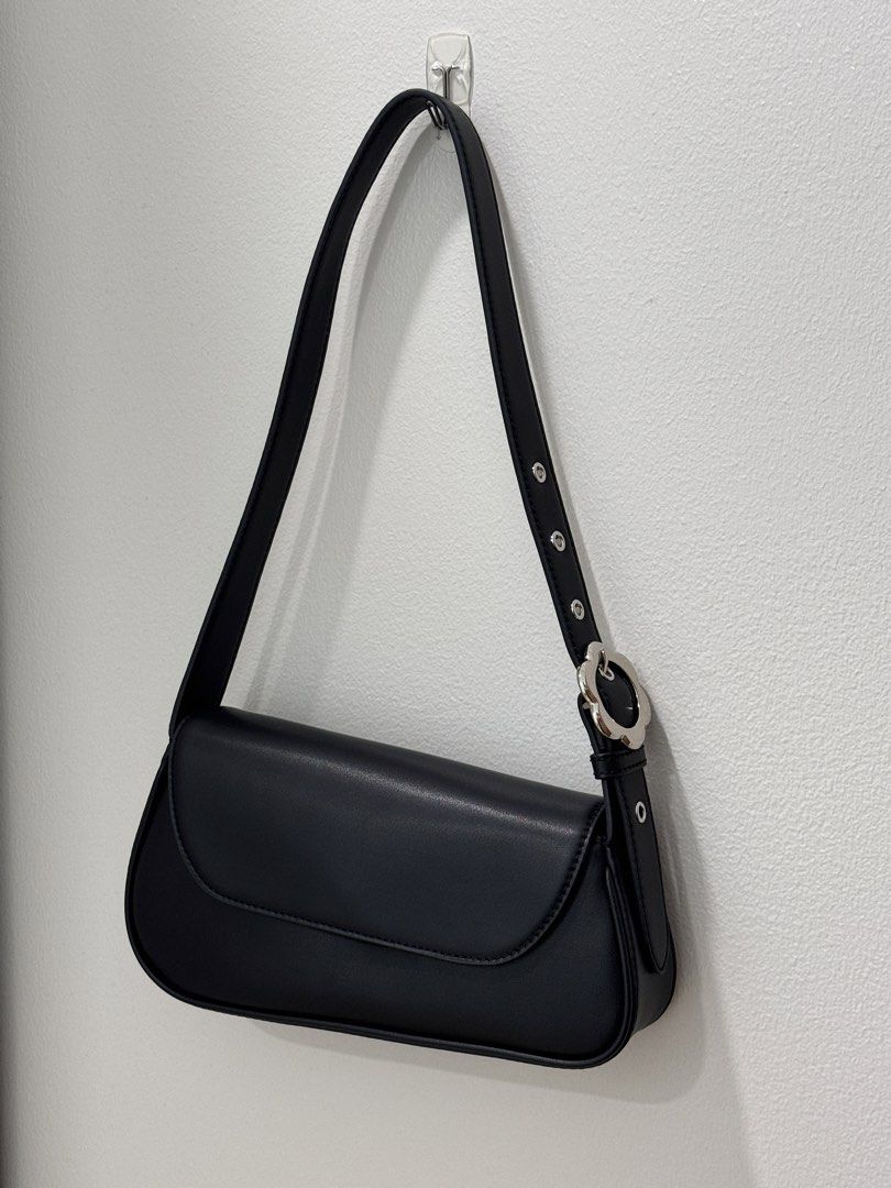 Charles & Keith Petra Asymmetrical Bag Black (Category: Shoulder Bags) located in Quezon City. Submitted by dreamhues (Listing ID 1428280629, Image 1). Description: Charles & Keith Petra Asymmetrical Shoulder Bag → Colorway: Black → Lightly used only, no obvious flaws but may have light scratches from use → Rare design (discontinued in store & online) → Resell value goes up to 200k KRW (8k PHP).
