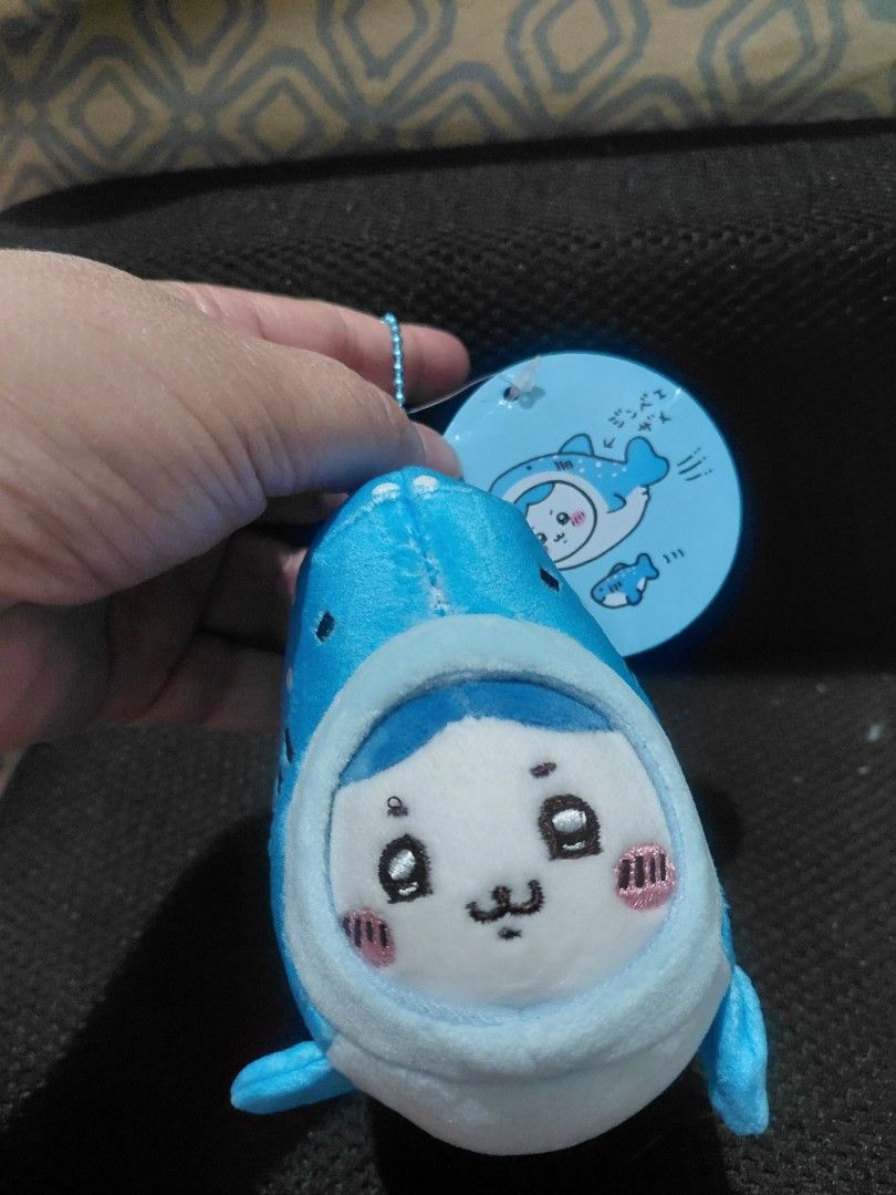 Chiikawa Whale Plushie with Tag (Category: Plushies & Soft Toys) located in Manila. Submitted by bashamylove0116 (Listing ID 1428410945, Image 2). Description: Adorable Chiikawa whale plushie. Features a blue and white design with a cute face. Comes with a matching tag. The plushie has a small loop for attaching to a keychain or bag. The tag has Japanese text and a cute illustration of the character..