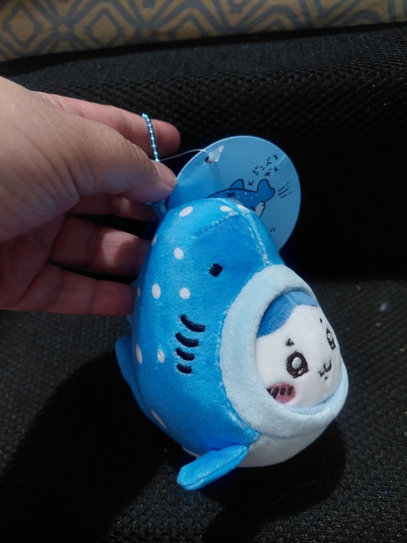 Chiikawa Whale Plushie with Tag (Category: Plushies & Soft Toys) located in Manila. Submitted by bashamylove0116 (Listing ID 1428410945, Image 3). Description: Adorable Chiikawa whale plushie. Features a blue and white design with a cute face. Comes with a matching tag. The plushie has a small loop for attaching to a keychain or bag. The tag has Japanese text and a cute illustration of the character..