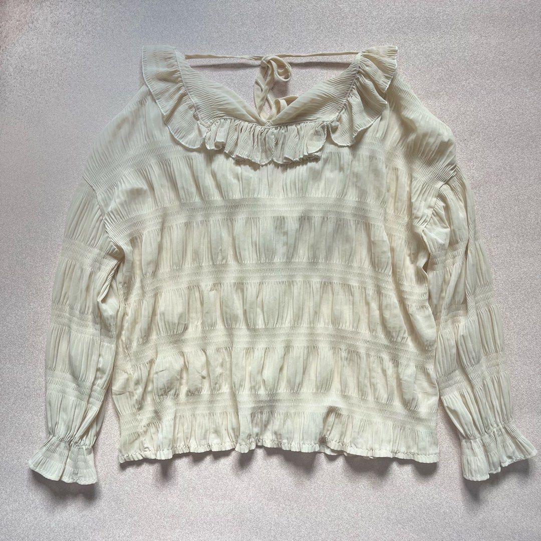 light yellow ruffle oversized button down long sleeve blouse top (Category: Blouses) located in Manila. Submitted by ekses (Listing ID 1428344289, Image 3). Description: - this is cute ww - oversized fit laid flat measurements width: 21” length: 21” shoulder length: 18”.