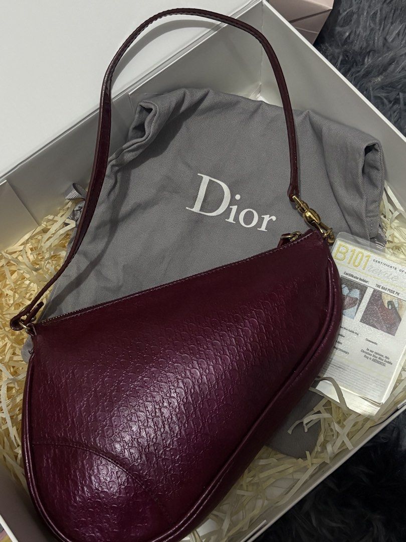 Dior Saddle Bag Burgundy (Category: Luxury Bags & Wallets) located in Dasmarinas. Submitted by kddeclutterr (Listing ID 1428298486, Image 1). Description: END OF THE MONTH SALE ! Authentic Vintage Dior Saddle Bag in Burgundy MESSAGE FOR MORE PICTURES! - With certificate of authenticity - Like new fresh from bag spa! - OPEN FOR TRADES (PREFERABLY SILVER DIOR SADDLE BAG SAME MODEL !).