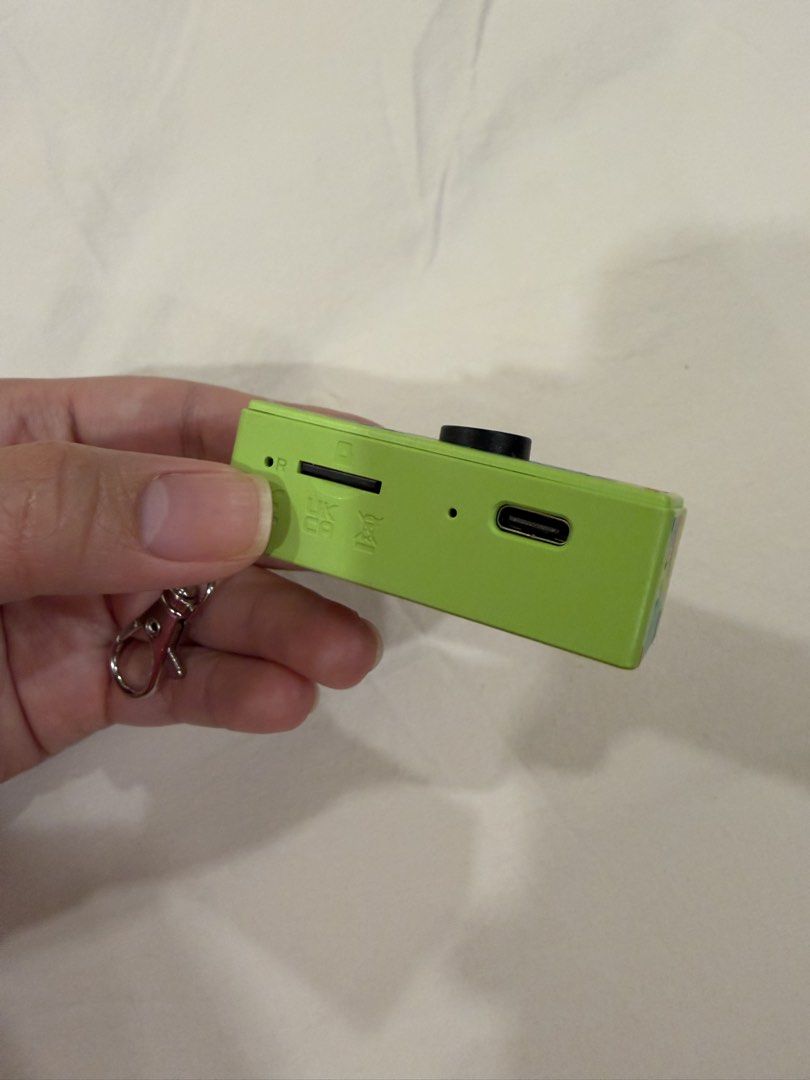 Rare color G6 Thumb Camera (Category: Cameras) located in Quezon City. Submitted by PrelovedTreasureees (Listing ID 1428328767, Image 3). Description: Purchased on Jan 2026 for 934 (995 original price). Only used a couple of times, mostly used as a bag charm. Inclusions and features: - 8 gb memory card included - All inclusions still complete (keychain, necklace attachment, charger, manual, box) - Can take photos, videos, and record audio - See 7