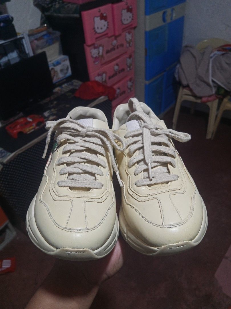 Gucci Rhyton Sneakers (Category: Sneakers) located in Zamboanga. Submitted by alminajammang19 (Listing ID 1428426074, Image 1). Description: Authentic Gucci Rhyton sneakers. Features the iconic Gucci logo on the side and insole. Made in Italy. The shoes have a cream color with a chunky sole. Size 35. Includes the Gucci logo on the tongue and the bottom of the shoe. The shoes have a lace-up closure..